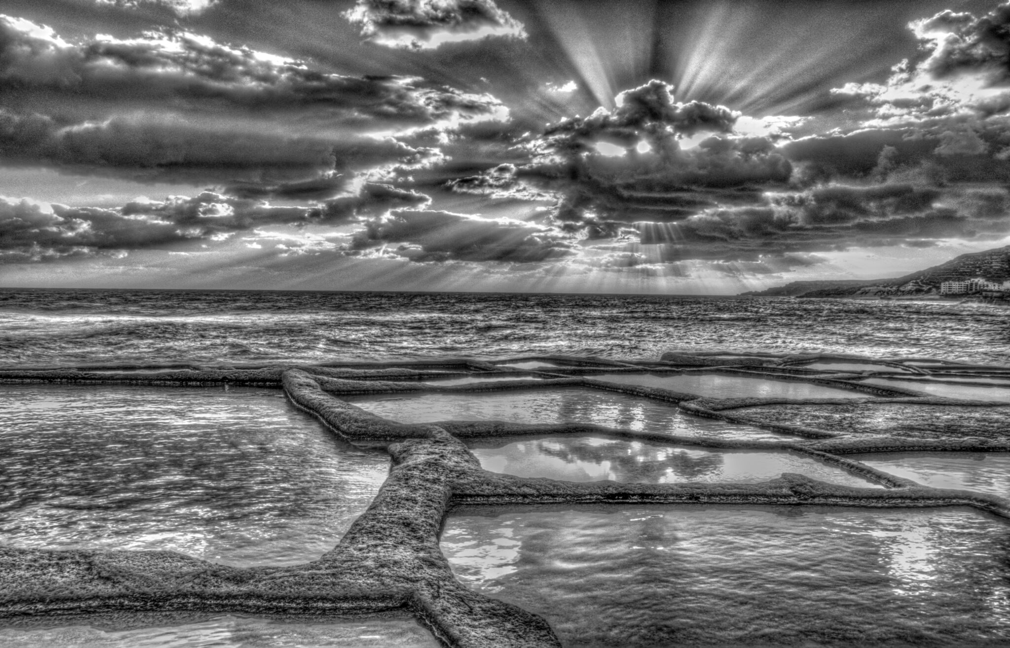 black and white photo of the salt pan in marsalforn