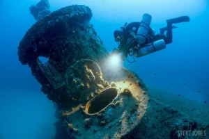 Photo of Diver next to the HMS Stubborn